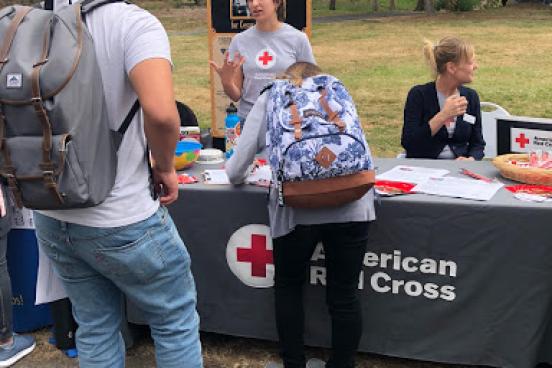 Student at the Red Cross table at a resource fair